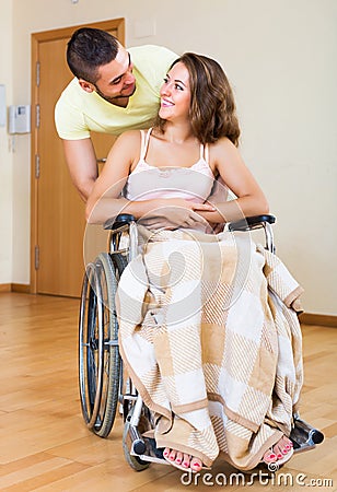 Happy couple with disabled spouse Stock Photo