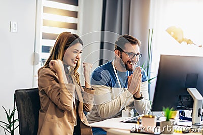 Couple doing business together working at home on the computer Stock Photo