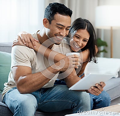 Happy couple, embrace and tablet for social media on sofa in house for news, meme or post. Man, woman and laugh for Stock Photo