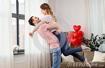 Happy couple at home on valentines day Stock Photo