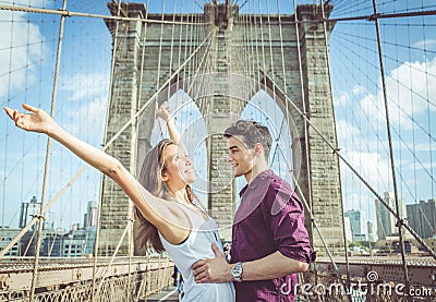 Happy couple hugging each other on the famous brooklyn bridge Stock Photo