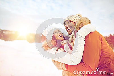 Happy couple hugging outdoors in winter Stock Photo