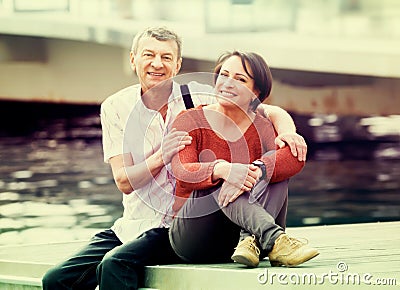 Happy couple in love posing outdoors together Stock Photo