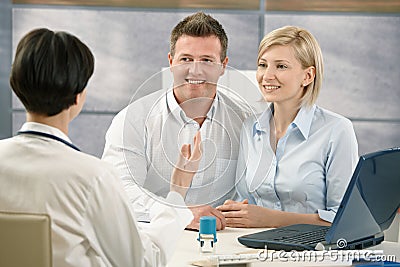 Happy couple at medical appointment Stock Photo