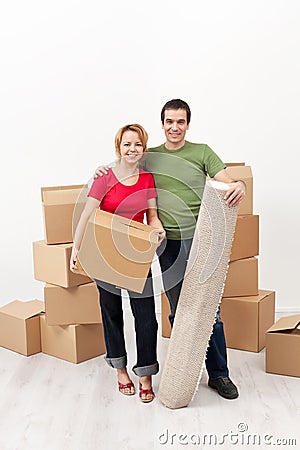 Happy couple moving together Stock Photo
