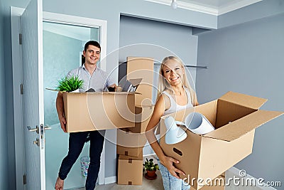 Happy couple in a new apartment for a housewarming. Stock Photo