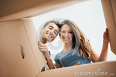 Happy couple opening a box Stock Photo