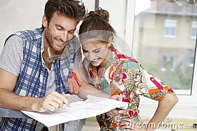 Happy couple planning a new home Stock Photo