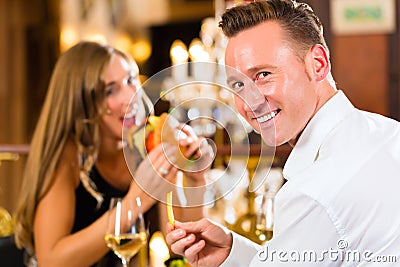 https://thumbs.dreamstime.com/x/happy-couple-restaurant-eat-fast-food-men-women-fine-dining-burger-fries-large-chandelier-background-31409164.jpg