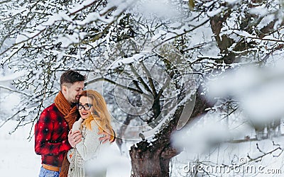 Happy Couple Smiling Hugging Holding Hands Sensitive Portrait Winter Snowfall Snow Beautiful Love Forest. Stock Photo