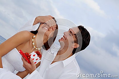 Happy couple with surprise gift Stock Photo