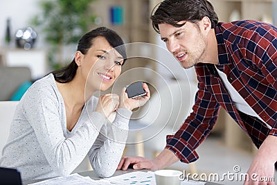 Happy couple talking about new projects Stock Photo