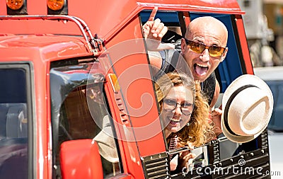 Happy couple of tourist travelers around Patong with tuk-tuk taxi Stock Photo