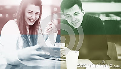 Happy couple using smartphone together and drinking coffee in cafe Stock Photo