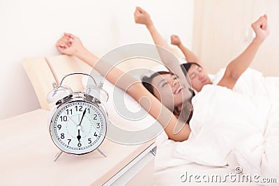 Happy Couple wake up in Bed Stock Photo