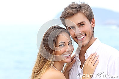 Happy couple with a white smile looking at camera Stock Photo