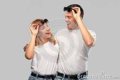 Happy couple in white t-shirts and sunglasses Stock Photo