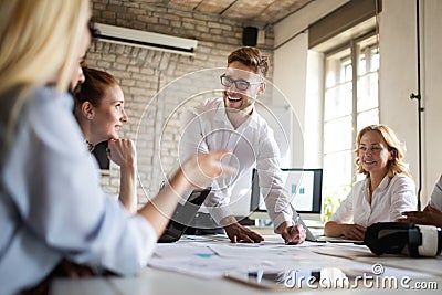 Happy creative team in office. Business, startup, design, people and teamwork concept Stock Photo