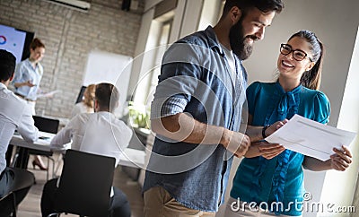 Happy creative team in office. Business, startup, design, people and teamwork concept Stock Photo