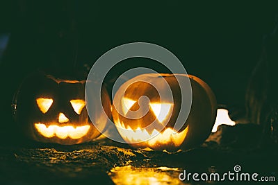 Happy and creepy traditional Halloween jack-o-lantern pumpkins Stock Photo