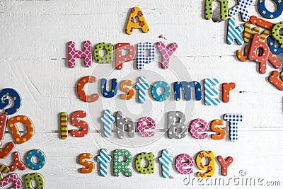 A happy customer is the best strategy text from colourful letters on white background, customer care concept Stock Photo