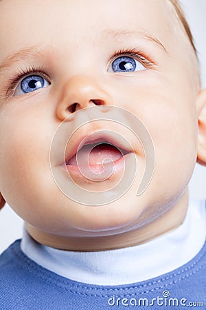 Happy cute baby boy with blue eyes Stock Photo