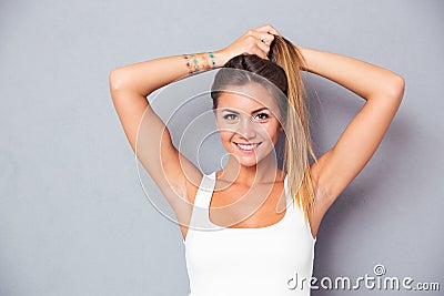 Happy cute girl holding her ponytail Stock Photo