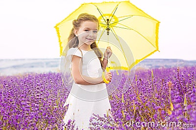 Happy cute little girl in lavender field with Stock Photo