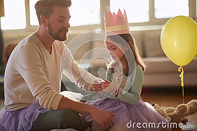 Happy dad and daughter dressing up toghether Stock Photo