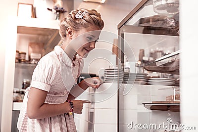 Happy delighted girl looking at the display Stock Photo