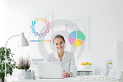 Happy dietician in the office Stock Photo