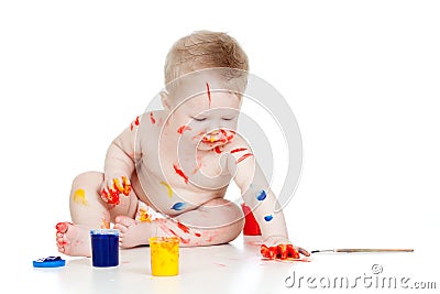 Happy dirty child with paints Stock Photo