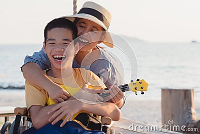 Happy disability kid travel in family holiday concept. Stock Photo