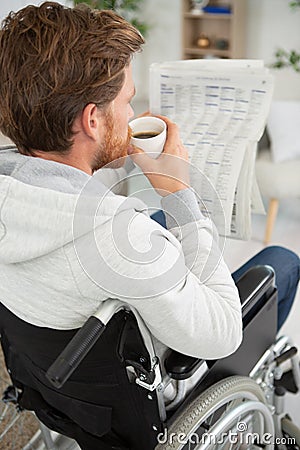 happy disable man reading news Stock Photo