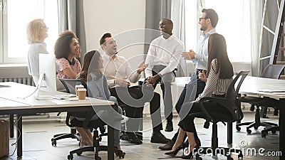 Happy diverse business team employees having fun at corporate meeting Stock Photo