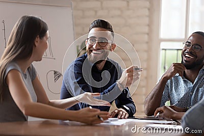 Happy diverse creative business team people talking at group meeting Stock Photo