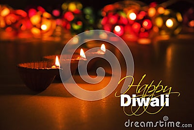 Happy diwali - diwali greeting card with illuminated diya Stock Photo