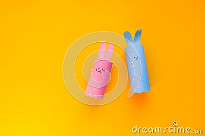 Happy DIY Easter decoration concept bunnies from toilet paper roll tube. Simple creative idea, easy crafts for kids. Eco Stock Photo