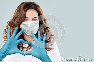 Happy doctor woman making heart. Help, support, healthy lifestyle, healthcare, medicine and ambulance concept Stock Photo