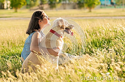 Happy dog and owner enjoying nature in the park Stock Photo