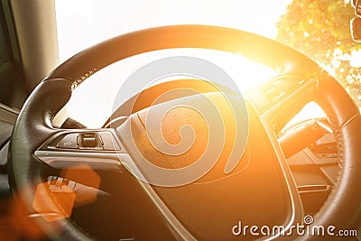 Happy driver inside car at sunset. Young man have fun ride trip travel on road in summer sunny day. Drive vacation concept Stock Photo