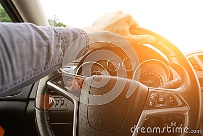 Happy driver inside car at sunset. Young man have fun ride trip travel on road in summer sunny day. Drive vacation Stock Photo