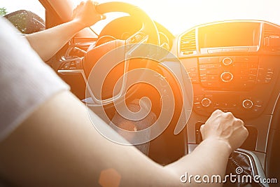 Happy driver inside car at sunset. Young woman have fun ride trip travel on road in summer sunny day. Drive vacation concept Stock Photo