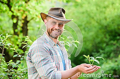 Happy earth day. Eco living. farming and agriculture cultivation. Gardening. muscular ranch man in cowboy hat care Stock Photo