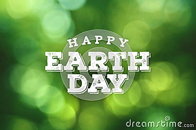 Happy Earth Day Rustic Text with Green Environmental Blurred Tree Leaf Bokeh Background Stock Photo