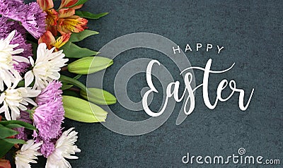 Happy Easter Calligraphy Holiday Script With Colorful Spring Flowers Over Blackboard Background Texture Stock Photo