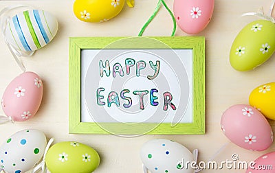 Happy Easter card in a frame with colorful eggs Stock Photo