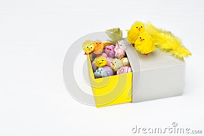 Happy Easter chicken family in an open box with colorful Easter eggs Stock Photo