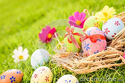 Happy easter! Closeup Colorful Easter eggs in nest Stock Photo