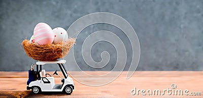 Happy Easter. Colorful painting eggs on golf car toy Stock Photo